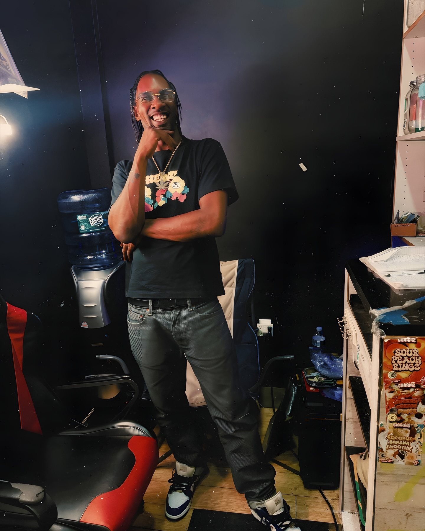 A smiling adult beside curated lifestyle goods