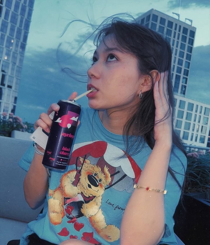 Guest sipping an Ayrloom black cherry at a Sustainably Stoned rooftop gathering